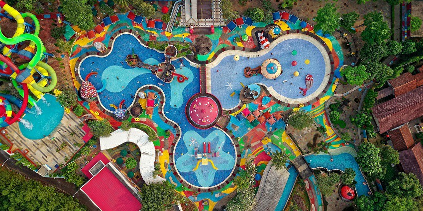 Bird's-eye view of Wonder World Water Park featuring a swimming pool and colourful slides.