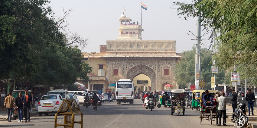 Tulsi Marg Street and the gate with grand architectural entrance and a lively street.