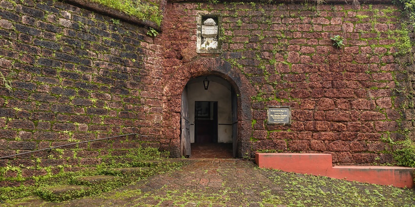 An entrance door welcomes visitors to the historic grounds of Reis Magos Fort.