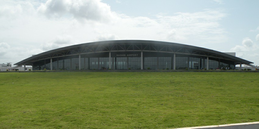 Aerial view of Nashik Airport with runways and surrounding infrastructure.