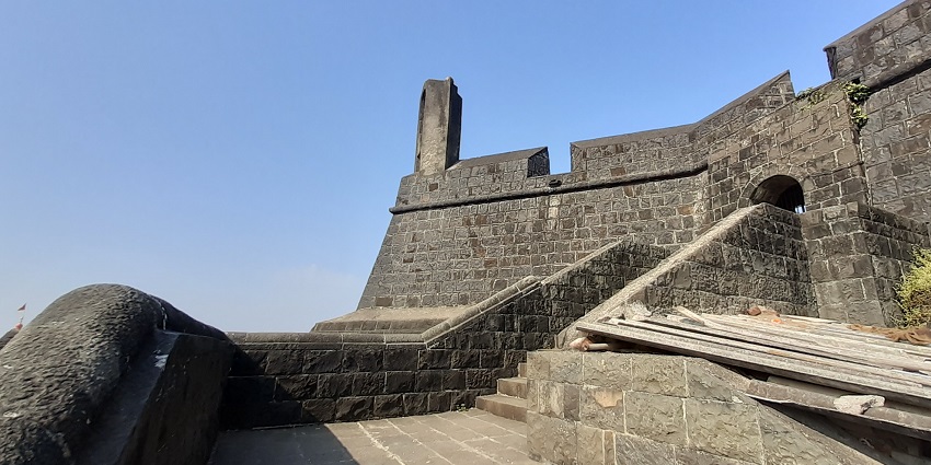 Historic entrance of Worli Fort in Mumbai, showcasing its stone archway and aged walls