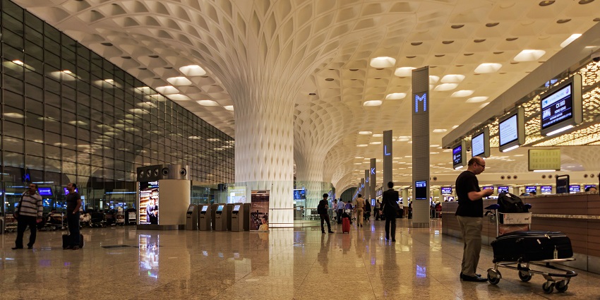 Interior view of Mumbai's international airport terminal, featuring modern architecture.