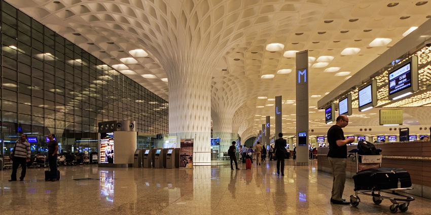 Interior view of Mumbai's international airport terminal, featuring modern architecture.