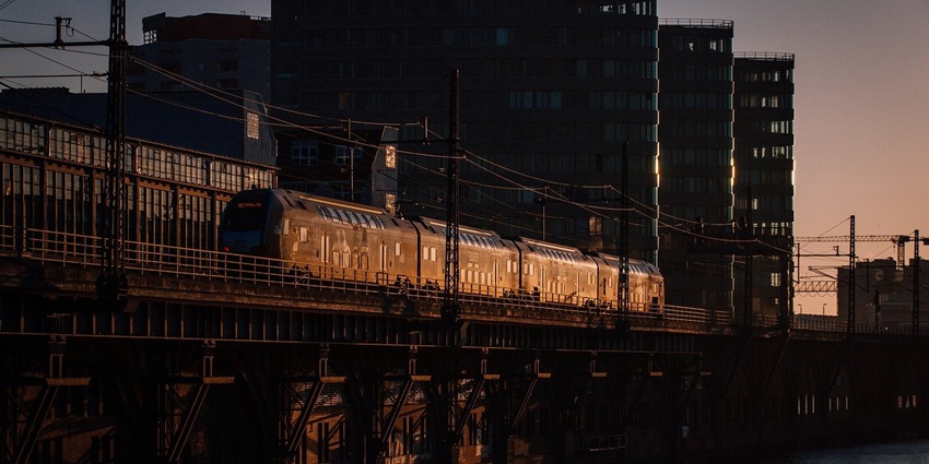 City train navigating urban tracks, showcasing efficient public transportation system.