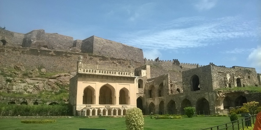 Image of the fort building with a garden affront and the clear blue sky in the background