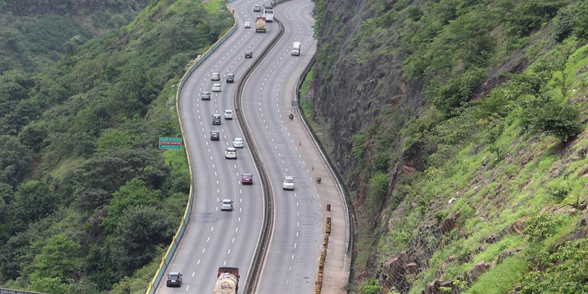 A view of the Mumbai-Pune Expressway showing multiple lanes and vehicles travelling