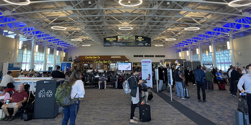 An image of busy passengers at the popular Charlotte Douglas International Airport.