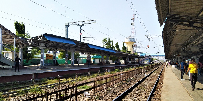 Nasik Road railway station features waiting passengers and trains