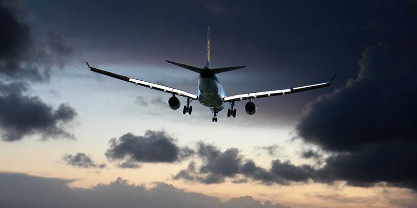 Airplane in flight with clear skies, showcasing transportation and travel themes.