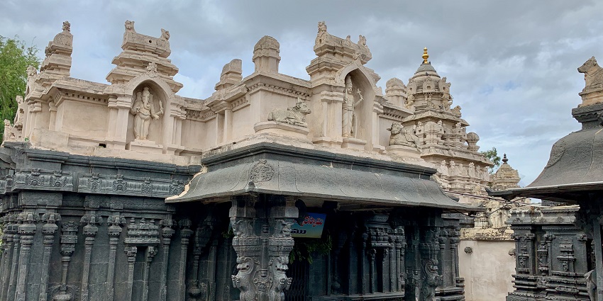 View of the intricate architecture of the temple against the clear blue sky