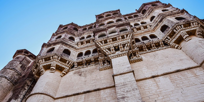 An image showing a majestic fortress perched atop a rock, reminiscent of the stunning Gorakhgad Fort