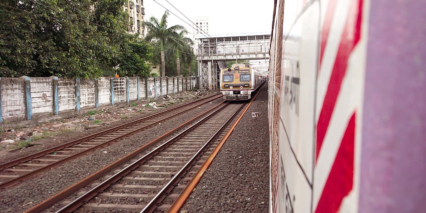 Image of Mumbai local train passing another train during day time