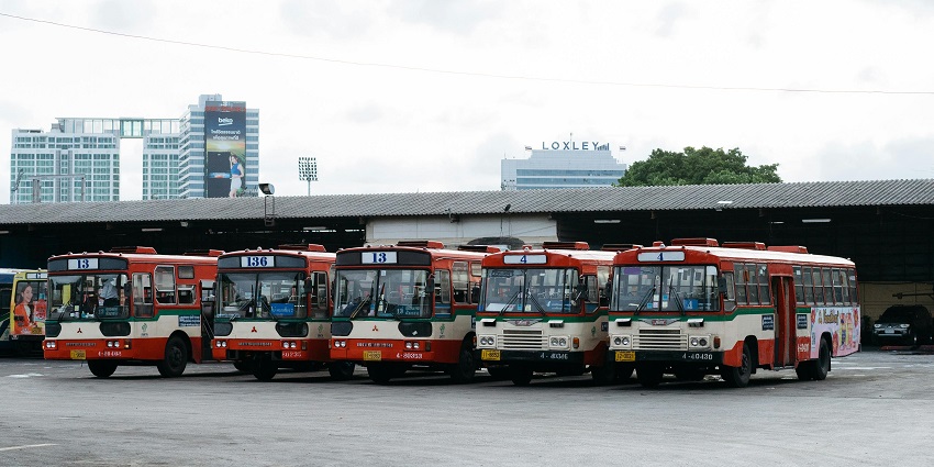 Image of buses in a parking lot perked and ready for the journey to the monastery