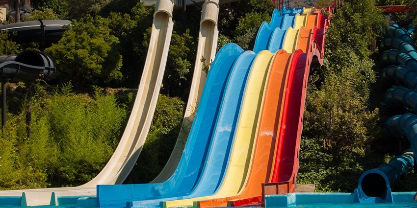 Vibrant sildes twists leading down into the swimming pool at the Krushnai water park