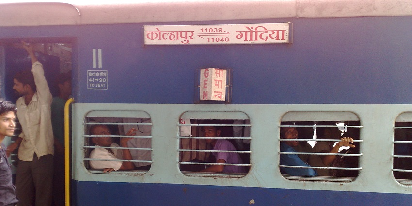 Maharashtra Express train passing through a rural landscape in Maharashtra.