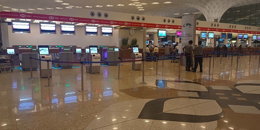 Chhatrapati Shivaji Maharaj Airport showcasing modern architecture and vibrant signage.