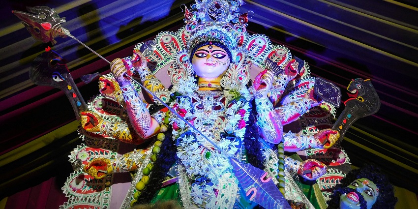 A beautiful idol of Godess Durga inside the temple, adorned with vibrant clothes and jewels