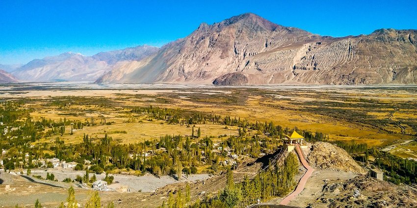 A picture of a beautiful valley in Ladakh with a mountain visible in the background