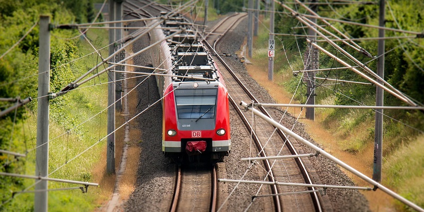 Train on the railroad tracks, representing efficient transport and travel options.