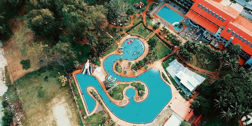 The image of an aerial view of a luxurious outdoor pool area in Sentosa Water Park Pune.