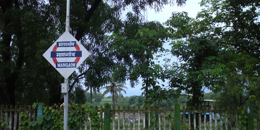 Mangaon Railway Station board displaying the station name in Marathi and English