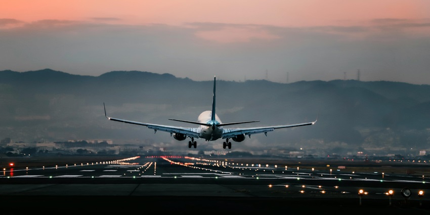 An image of an aeroplane landing at Kualanamu International Airport to reach Sumatra Island.