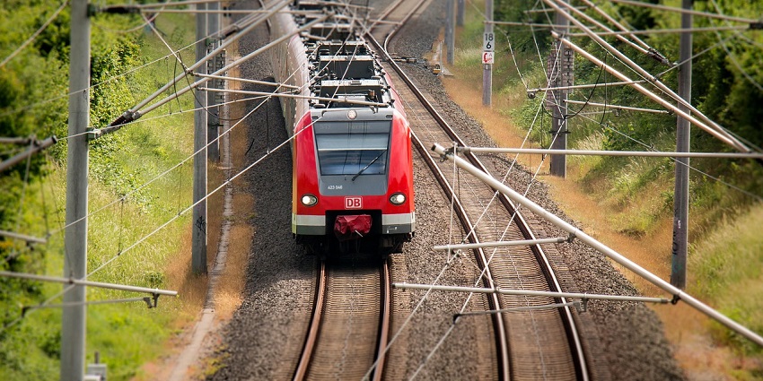 Train on the railroad tracks, representing efficient transport and travel options.