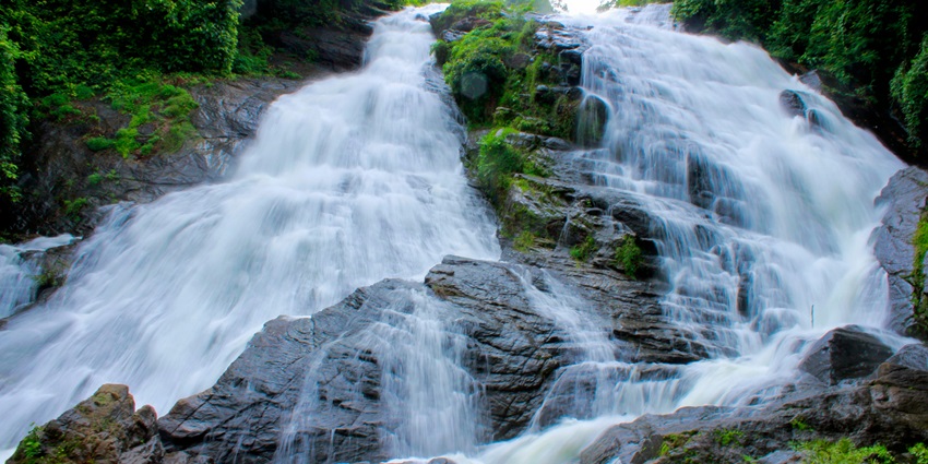 Low angle shot of a waterfall flowing down a mountain