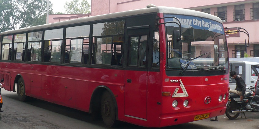 City bus on a busy street in Nagpur, Maharashtra, showcasing urban transport