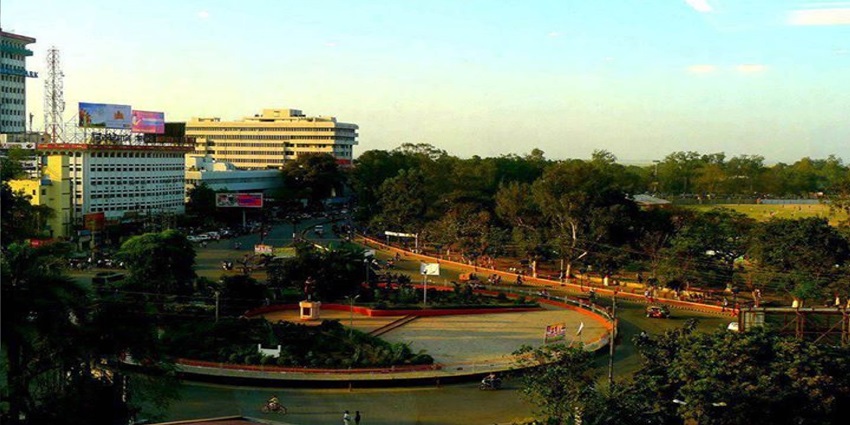 Wide view of Patna with buildings reflecting the city and Gandhi Maidan at the centre