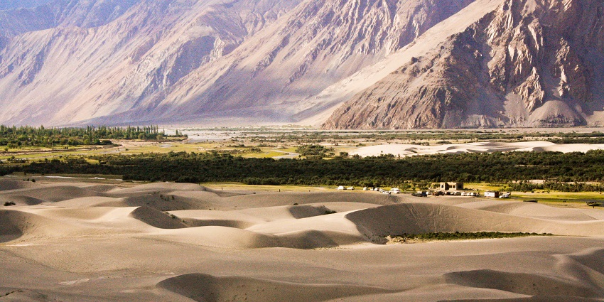 Stunning landscape of Hunder in Ladakh, showcasing sand dunes and mountains.