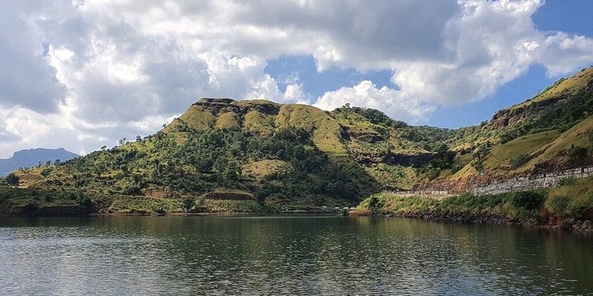 Bhavli Reservoir in Igatpuri with composed water surrounded by lush green hills