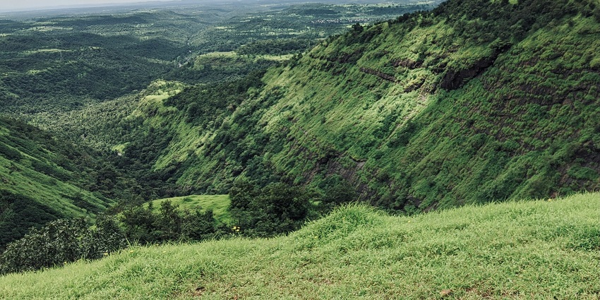 A bird’s eye view of towering hills decked with lush green vegetation in Igatpuri, Nashik.