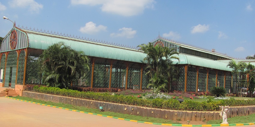 Tourist places in Dharwad feature the Indira Gandhi Glass House Garden with exotic plants.