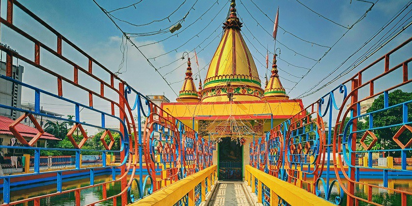 A mesmerising view of the iconic Iskcon Temple adorned with colourful vibrant shades.