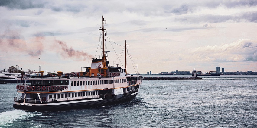 The cruise party in Bali features shimmering blue waters and a quaint backdrop.