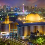 A representative picture of Istiqlal Mosque illuminated at night.