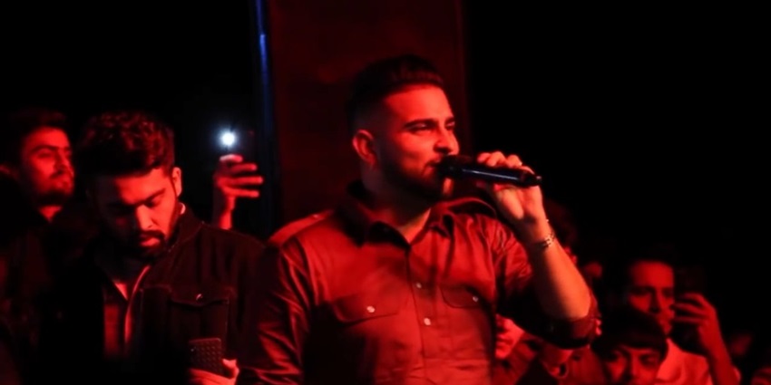 An image of Karan Aujla performing during the "It Was All A Dream World Tour," an exciting music festival in Chandigarh.