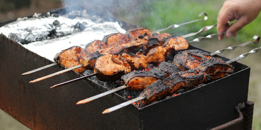 Seekh Kebabs, made of spiced meats on metal rods grilled on an open coal fire.