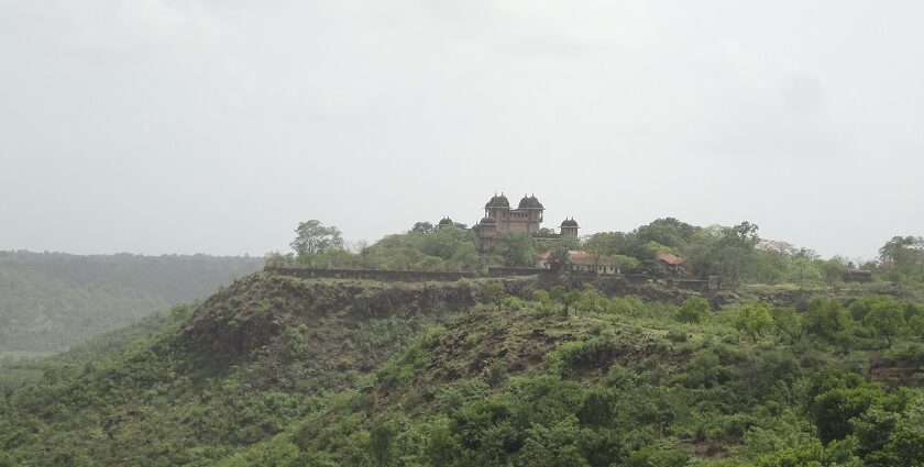 Jai Vilas Jawhar Fort features historic architecture, lush gardens, and panoramic views