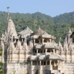 Picturesque view of the Mahaveer Jain temple surrounded by greenery, one of the best Jain temples in Goa