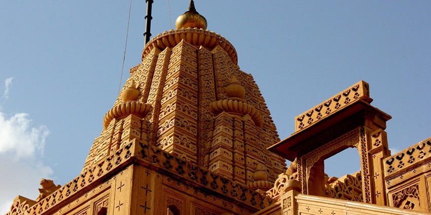 The stunning facade of the temple in Rajasthan features intricate stone carvings