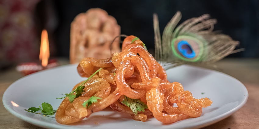 Snapshot of the sweet deep fried Jalebi which is dipped in the sweet home made Serum