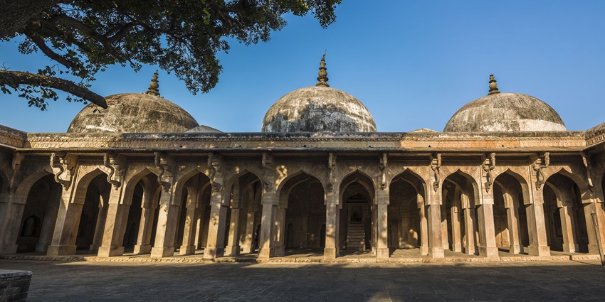View of Jama Masjid in Chanderi featuring the grand arches and domes near Lohani caves.