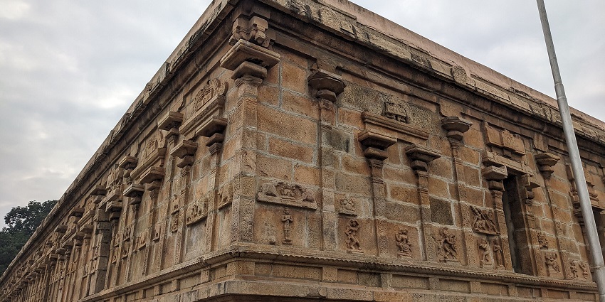 Surroundings of Jambukeswarar Temple in Thiruvanaikaval with trees and ancient walls.