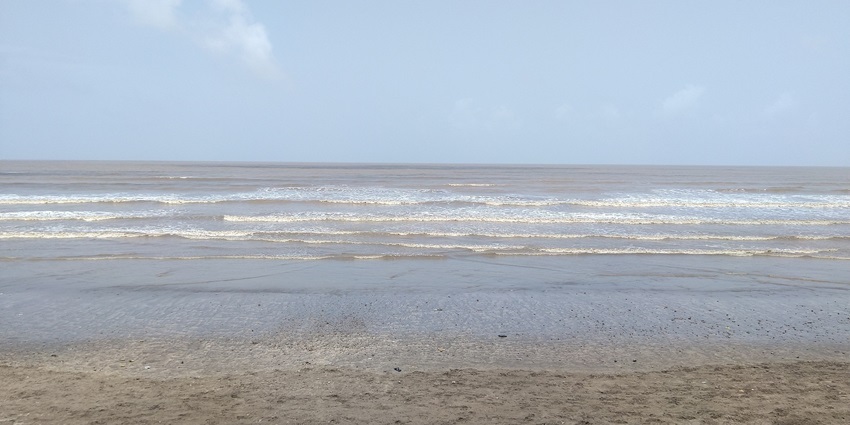 A serene coastline with clear skies.