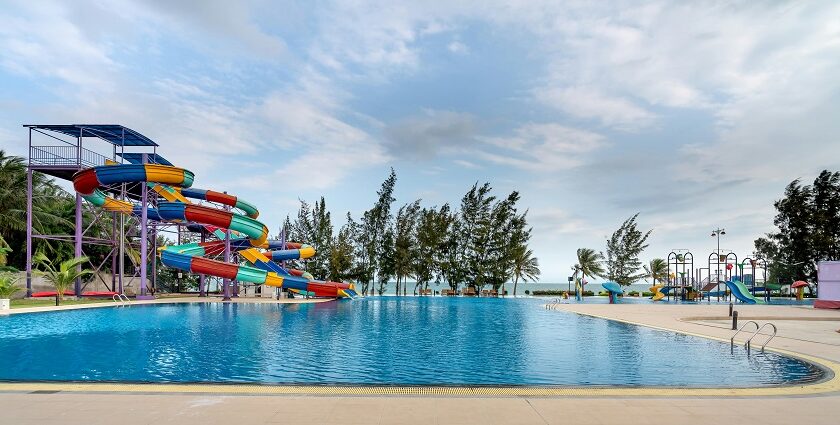 Image of colourful slide beside the swimming pool - explore Jamshedpur water park