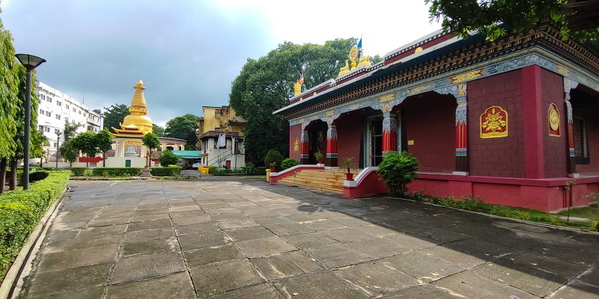 The brown and red combination temple inside the Bodh Gaya Monastery with monuments.