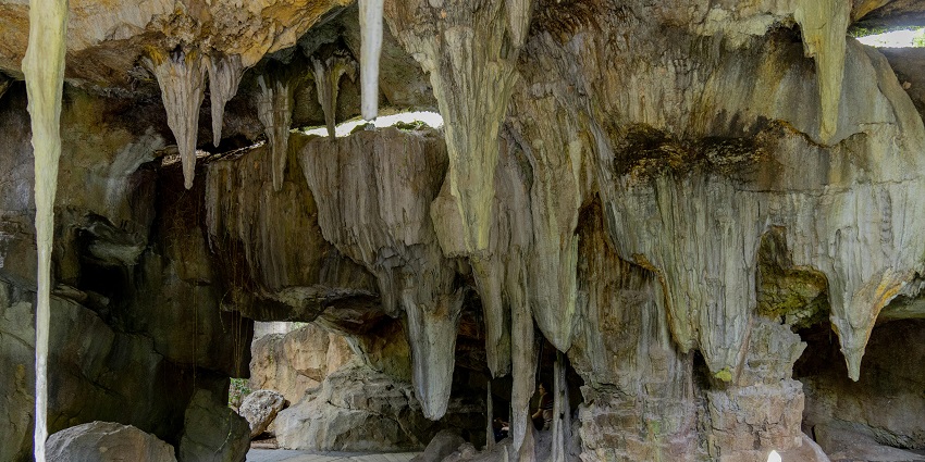An image view of Jata Shankar Cave, showcasing unique rock formations in a serene setting.