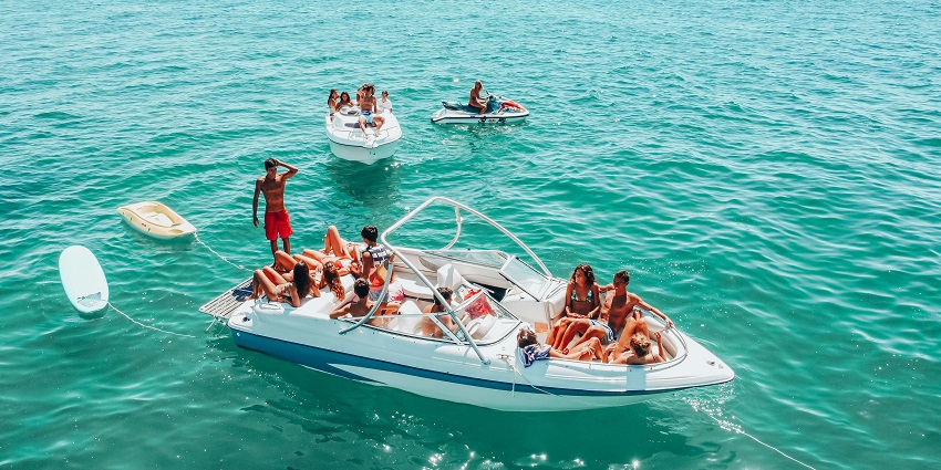 A picture of a group having a blast in turquoise water at Tarkarli in Maharashtra.